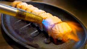 This Sushi Chef's Salmon Roll Technique Is on Fire - Literally!