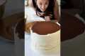 decorating a gold cake for cake